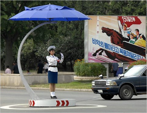 An undated photograph released by North Korea’s official news agency shows a woman directing traffic in Pyongyang on one of the new covered podiums found in intersections across the city, which has no traffic lights.

શું આપણે ત્યાં આવા Traffic Controllers હોય તો Traffic Controlમાં રહે ખરા?