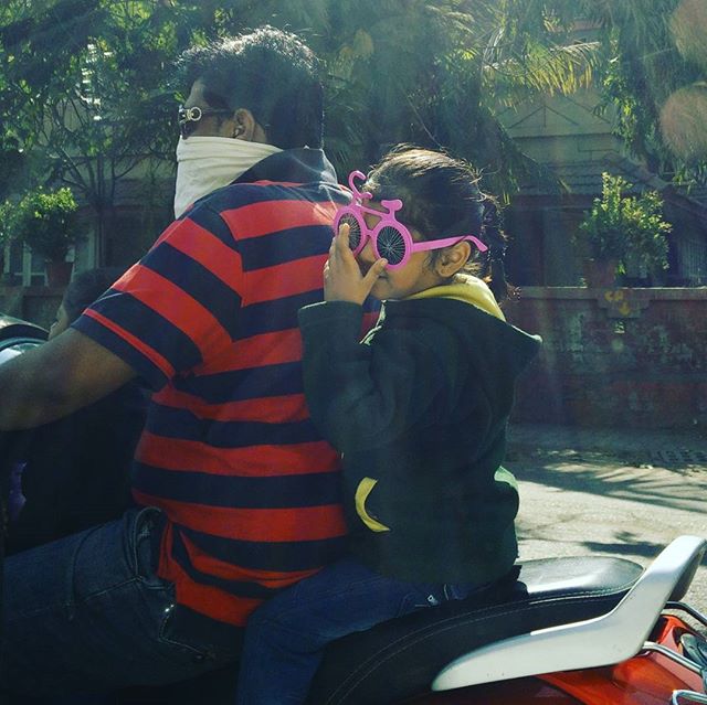 Saw this cute girl wearing #cycle wale #goggles #amdavad ke #raste par! But the dad isnt wearing a #helmet

#glares #bicycle #pink